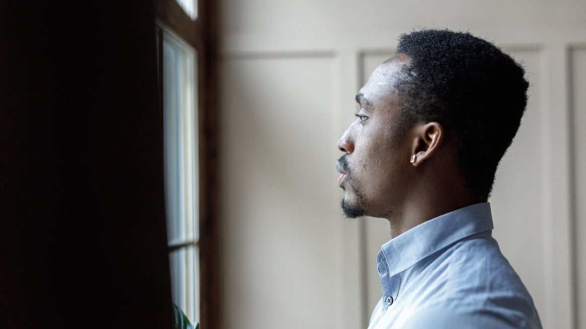 all-or-nothing-thinking-man-looking-out-of-the-window