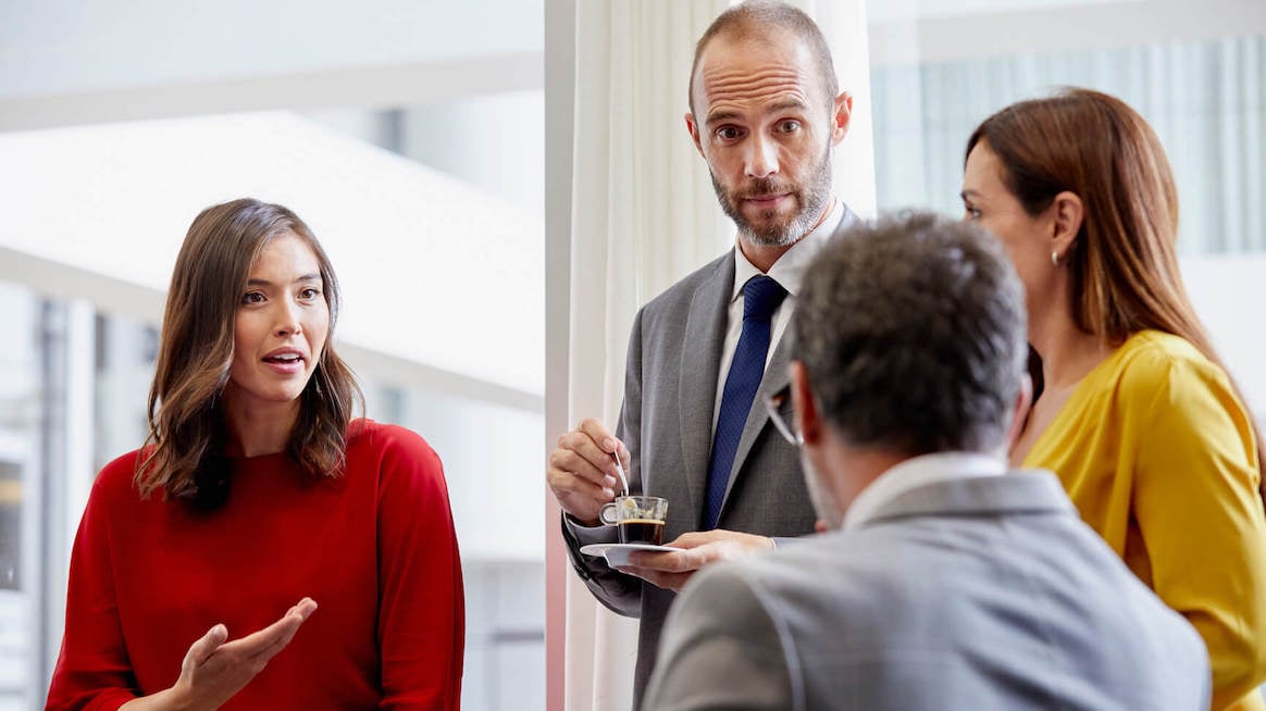 communication-feedback-coworkers-talking