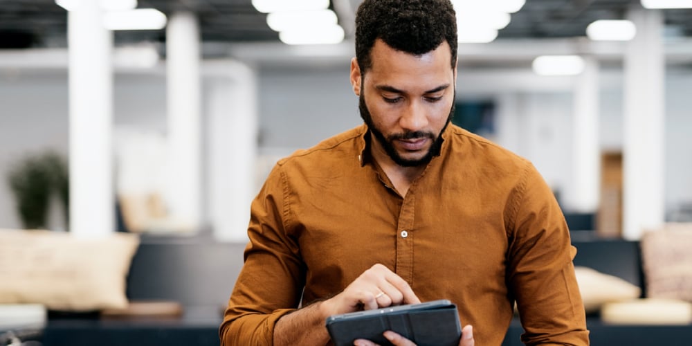 man on tablet - how to improve focus and concentration