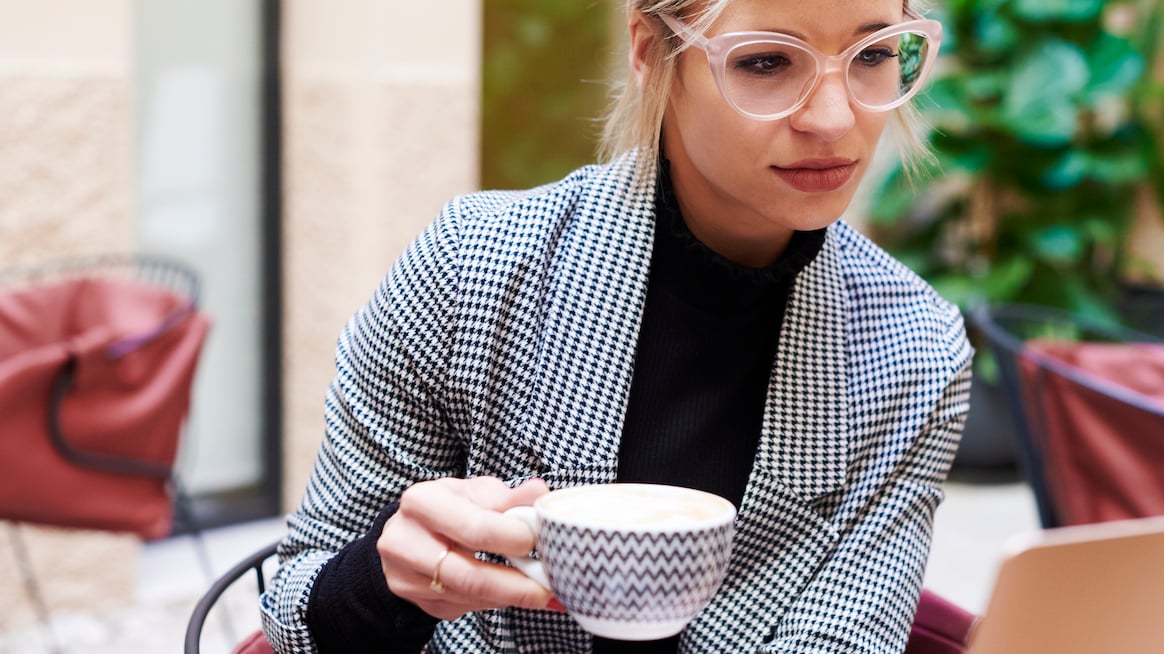 person-working-while-sipping-cup-food-for-concentration