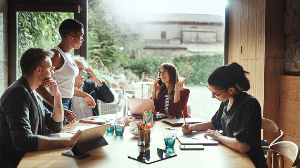 team-around-table-building-relationships-team-performance-leader-skill