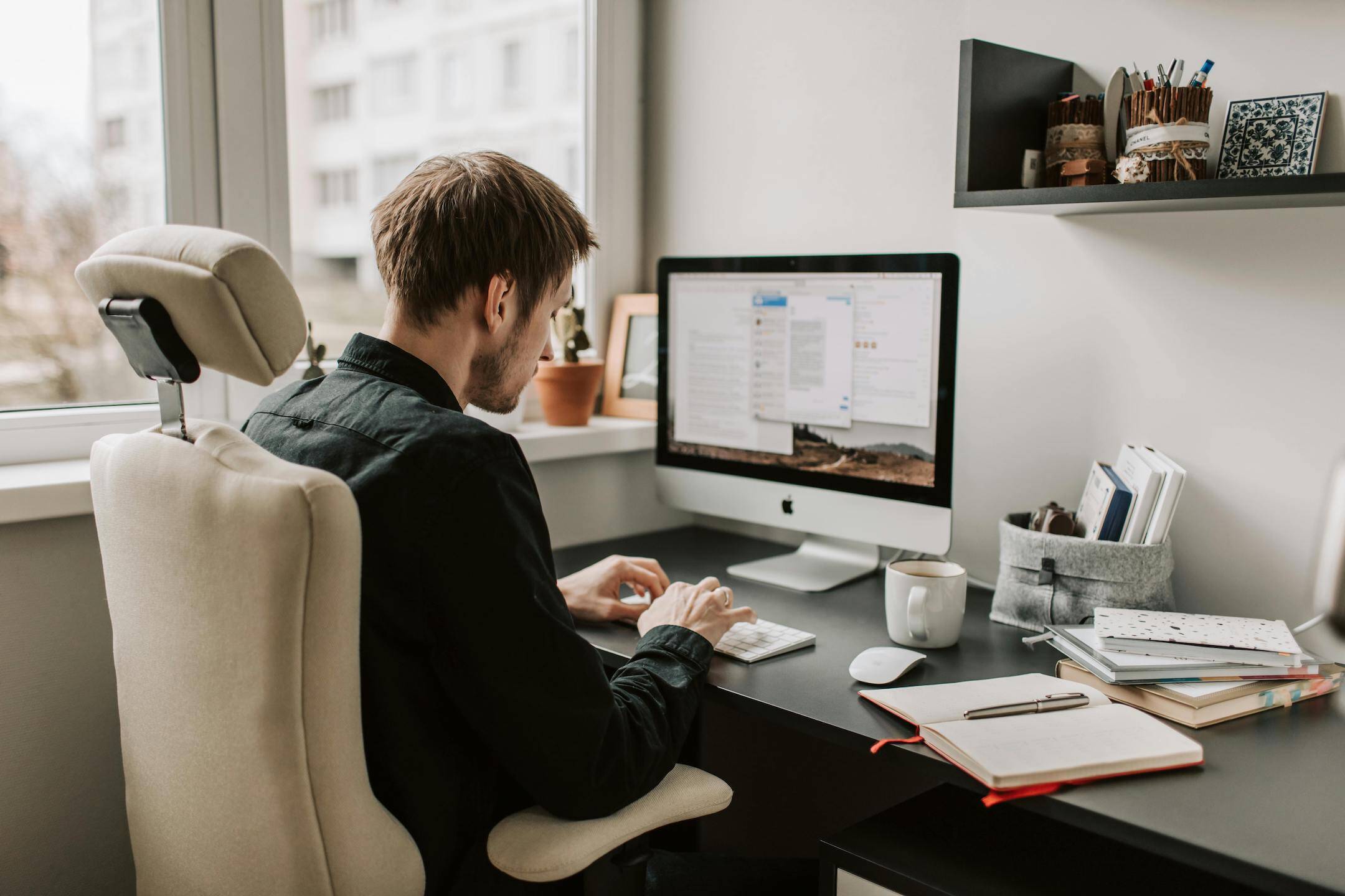 person-working-at-desk-using-productivity-tips
