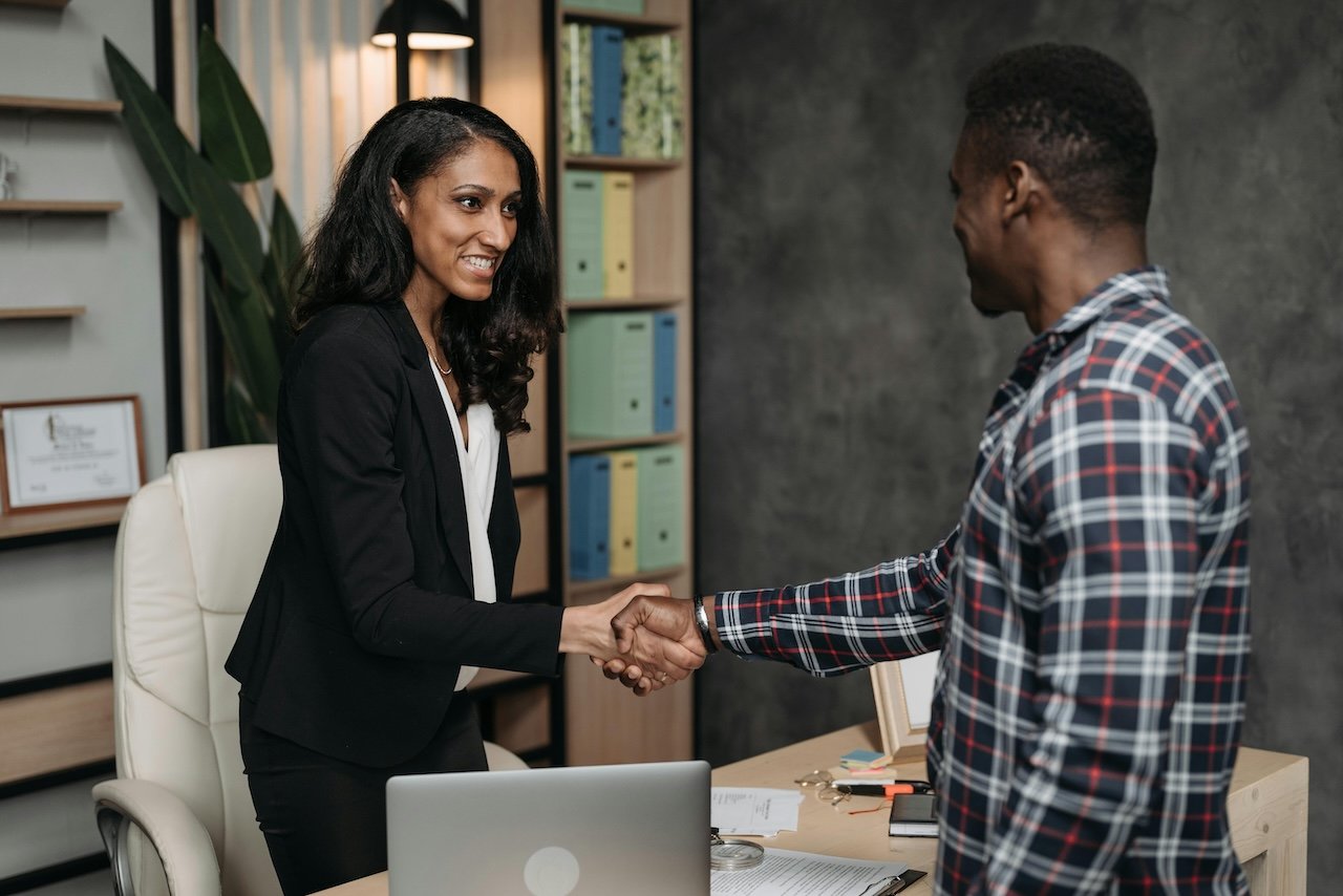 women-and-men-shaking-hands-negotiate-a-job-offer