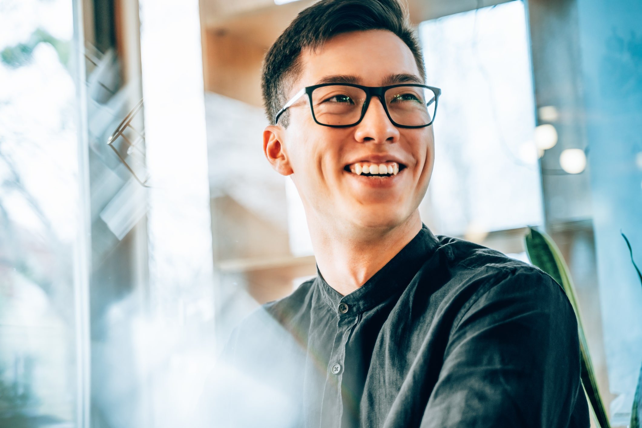 Young-entrepreneur-smiling-and-looking-forward-to-the-future-innovations-smart-goals-examples